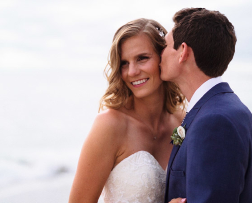 Groom kisses Bride on beach in La Jolla Cove Wedding Video