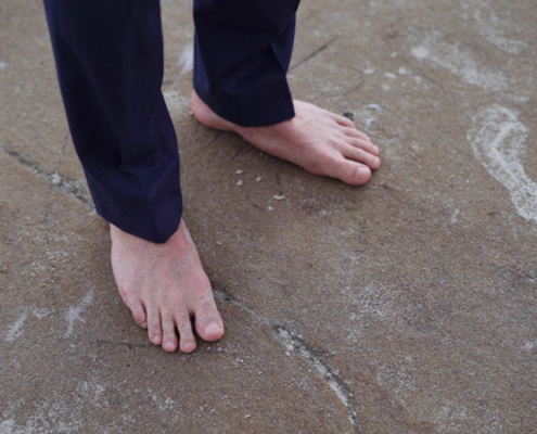 Groom stands barefoot at ocean La Jolla Cove Wedding Video