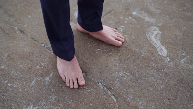 Groom stands barefoot at ocean La Jolla Cove Wedding Video