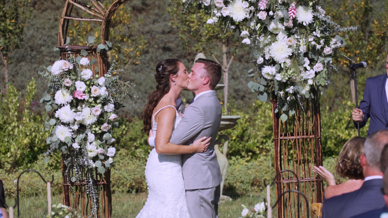 Bride and groom kiss