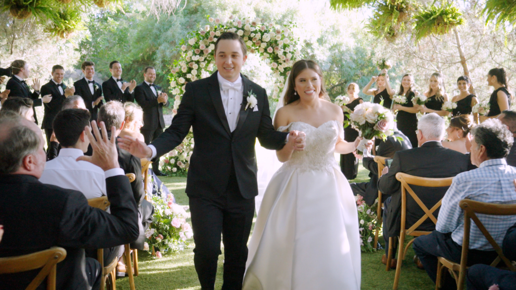 Ethereal Gardens Wedding Bride walks down the aisle after being married