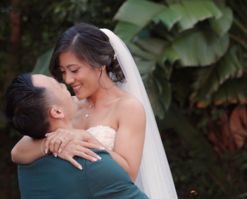 Groom picks up Bride