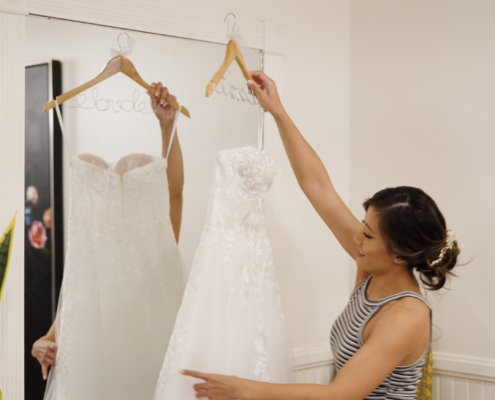 Bride checks out her dress at Botanica