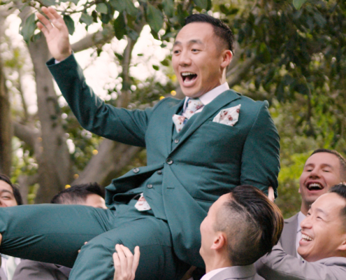 Groomsmen picking up groom at Botanica