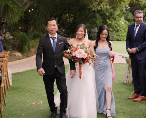 Bride comes down the aisle at Botanica