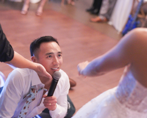 Groom sings to bride at wedding reception at Botanica Trademark venues