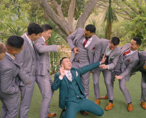 Crazy groomsmen taking photos at Botanica in Oceanside california