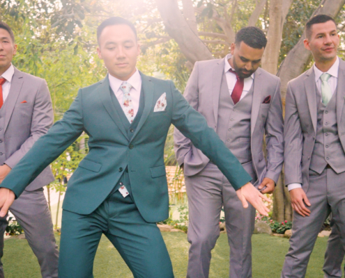 Groom shows his dance moves during photos