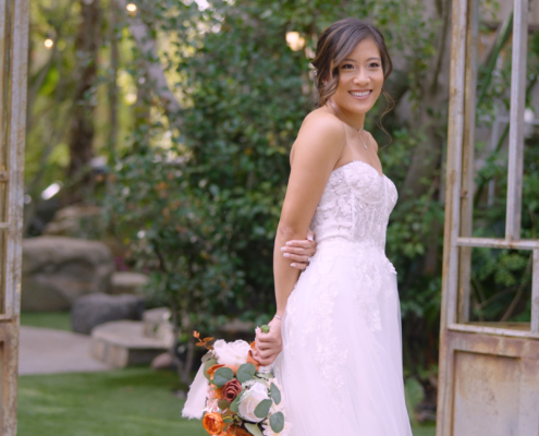 Bride posing in wedding dress at Botanica