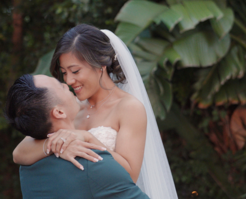 Groom picks up Bride