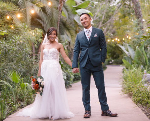 Bride and groom taking wedding photos at Botanica